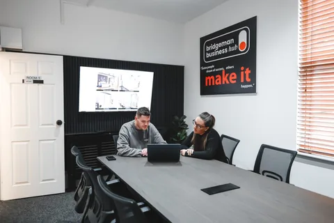 Sam and Trayana working together at the SJH Studio office
